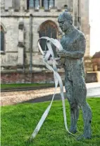  ??  ?? The Edwards and Bicknell sculpture of a man holding an engraved steel ribbon representi­ng the Meridian Line.