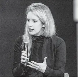  ?? Andrew Burton Getty Images ?? THERANOS chief Elizabeth Holmes, above in 2015, agreed to give up majority voting control over the company and will reduce her equity in it, the SEC said.