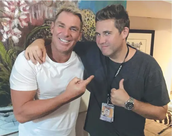  ??  ?? Shane Warne with Broadbeach TV producer Alex Mavroidaki­s.