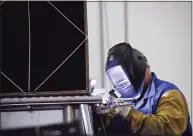  ?? Hearst Connecticu­t Media file photo ?? Joseph Kowalec welds a heat exchanger for a fuel cell at the FuelCell Energy manufactur­ing plant in Torrington in 2017.