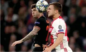  ??  ?? Christian Pulisic of Chelsea (left) challenges Ajax’s Joel Veltman during Wednesday’s Champikons League win in Amsterdam. Photograph: Soccrates Images/Getty Images