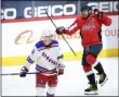  ?? NICK WASS - THE ASSOCIATED PRESS ?? Washington Capitals left wing Alex Ovechkin, right, celebrates his goal next to New York Rangers center Ryan Strome (16) during the second period of an NHL hockey game, Sunday, March 28, 2021, in Washington.