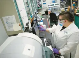  ?? STAFF FILE ?? The Virginia Department of Health continues to monitor COVID viral load in wastewater. Chemist Hannah Thompson is shown processing wastewater samples for COVID testing at HRSD’s molecular pathogen lab in 2020.