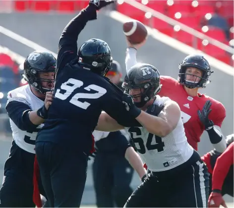 ?? TONY CALDWELL ?? Trevor Harris sets up to throw during practice at TD Place on Tuesday.