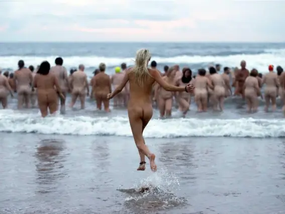  ?? (Reuters) ?? The North East Skinny Dip, where people run naked in aid of charity