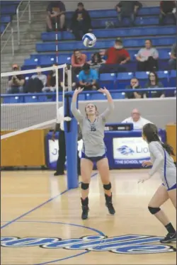  ?? Submitted photo ?? MATCH GAME: Senior setter Madison Back, pictured in a regular-season match, helps Jessievill­e advance in the Class 3A volleyball tournament with a 3-0 victory Monday over Flippin at Paris High School. The Lady Lions, seeded third from 3A-South, face...