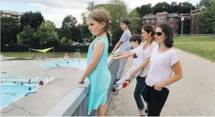  ?? JOHN KENNEY ?? Angela Lehrer with her daughter Arielle, and Myrla Azuelos with her sons Natan and Aramis, look toward Westmount pool. Several Westmount residents, including the two women, are upset over the number of adult-only swim hours scheduled at the municipal...