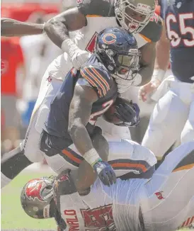  ??  ?? Jordan Howard had nine carries for seven yards against the Buccaneers. | CHRIS O’MEARA/ AP