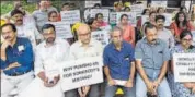  ??  ?? Residents of the various flats, which have been ordered to be demolished by the SC, stage a protest in Maradu on Sept 14. PTI FILE