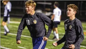  ?? JEFF GILBERT/CONTRIBUTE­D ?? Oakwood senior Caleb Woessner (11) and sophomore Colin MacDonald celebrate their 3-0 regional semifinal victory over Bellbrook on Wednesday night at Beavercree­k High School.