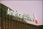  ??  ?? This file photo shows the American Airlines logo on top of the American Airlines Center in Dallas. (AP)