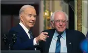 ?? MARK SCHIEFELBE­IN — THE ASSOCIATED PRESS ?? President Joe Biden stands with Sen. Bernie Sanders, I-Vt., after speaking about lowering health care costs in the Indian Treaty Room at the Eisenhower Executive Office Building on the White House complex in Washington, on Wednesday.