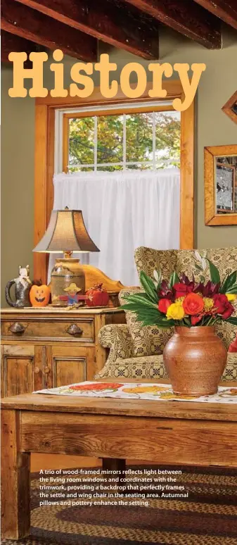  ??  ?? A trio of wood-framed mirrors reflects light between the living room windows and coordinate­s with the trimwork, providing a backdrop that perfectly frames the settle and wing chair in the seating area. Autumnal pillows and pottery enhance the setting.