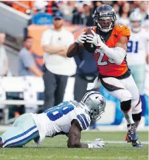  ?? JACK DEMPSEY/THE ASSOCIATED PRESS ?? Denver Broncos cornerback Chris Harris intercepts a pass intended for Dallas Cowboys wide receiver Dez Bryant during the second half of Sunday’s game in Denver.