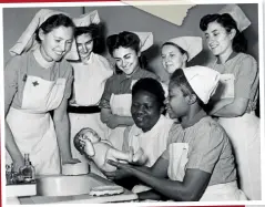  ??  ?? ABOVE Student nurses Moduph Marke from Freetown, Sierra Leone and Rebecca Solanke of Lagos, Nigeria hold a new born baby during a midwifery course at the National Training School for Midwives in Woolwich, London. February 5, 1948