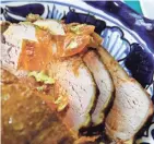  ?? ANGELA PETERSON, MILWAUKEE JOURNAL SENTINEL ?? Caribbean crock pot pork is coated with brown sugar, curry, cumin, salt and pepper.