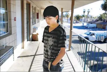  ?? Francine Orr
Los Angeles Times ?? EDDIE MARTINEZ, 14, at the Country Inn in San Bernardino in January. His mother was in jail at the time.