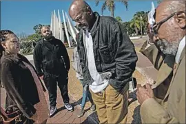  ??  ?? FAMILY MEMBERS of Simpson, including Deadra Johnson, left, Matthew Simpson, Martin Simpson and Joseph Adger, attended Brown’s sentencing.