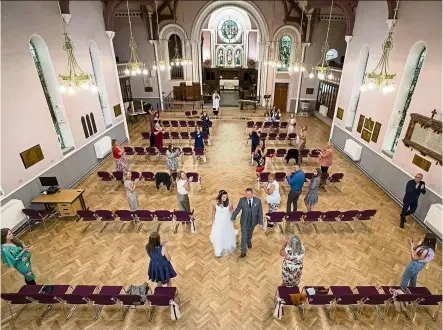  ??  ?? A socially distanced wedding ceremony in Liverpool. — Photos: dpa