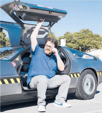  ?? BEN SKLAR/THE NEWYORKTIM­ES ?? Ernest Cline, an enthusiast of 1980s geek culture and author of“Ready Player Two,”with his DeLorean in Austin, Texas, in 2016.