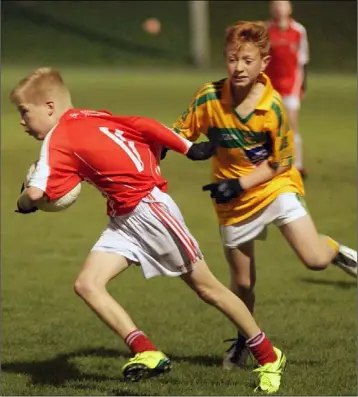  ??  ?? Cillian Byrne of Fethard on the move as Evan Cullen (Our Lady’s Island/Mayglass) gives chase.