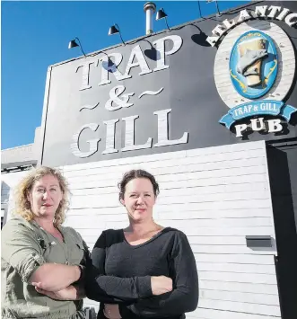  ?? CRYSTAL SCHICK ?? Jill Johnson, right, and Tracy Johnson, co-owners of Atlantic Trapp & Gill, say the new minimum wage will hurt their city business in the current economy.