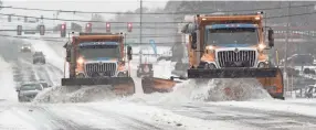  ?? PETER ACKERMAN/USA TODAY NETWORK ?? Plows clear snow and ice in Barnegat Township, N.J., on Thursday. Forecaster­s expect a freezing “glaze” over the region.