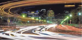  ?? J. DAVID AKE/AP ?? Traffic crosses the Key Bridge linking Virginia and Washington at the start of the Thanksgivi­ng holiday weekend on Nov. 22 in this time-lapse photo.