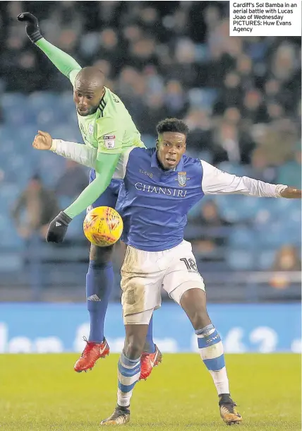  ??  ?? Cardiff’s Sol Bamba in an aerial battle with Lucas Joao of Wednesday PICTURES: Huw Evans Agency