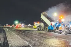  ??  ?? LAYER ONE: The first part of the Cairns Airport runway overlay was completed earlier this week.