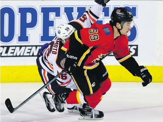  ?? AL CHAREST ?? Calgary Flames centre Dillon Dube, right, will be in the lineup when the team meets Edmonton for their first regular-season match, Saturday at the Scotiabank Saddledome.