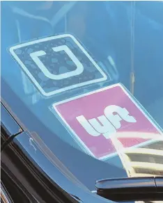  ?? AP FILE PHOTO ?? CALL US: Both Uber and Lyft are praising the state Senate’s proposed regulation­s for ride-hailing companies, while taxi and livery companies are opposed.