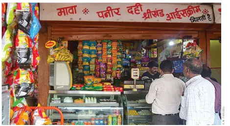  ?? ?? AT A SMALL SHOP in Bhopal, Madhya Pradesh, on June 30, 2017. Small businesses like these have been the worst affected by the GST regime.