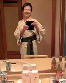  ??  ?? Justine Tyerman takes a quick selfie before heading off to dinner in her yukata. She loved the Japanese robe so much, it’s come home with her.