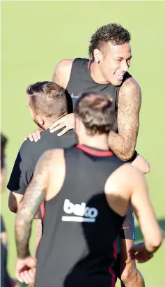  ?? — AFP photo ?? Barcelona player Neymar jokes with teammates during a training session at Barry University in Miami, Florida, on July 27, 2017, two days before their Internatio­nal Champions Cup friendly match against Real Madrid.