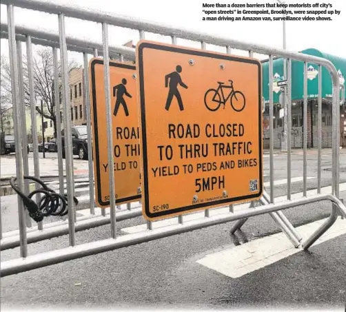  ??  ?? More than a dozen barriers that keep motorists off city’s “open streets” in Greenpoint, Brooklyn, were snapped up by a man driving an Amazon van, surveillan­ce video shows.