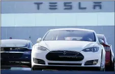  ?? DAVID ZALUBOWSKI — THE ASSOCIATED PRESS FILE ?? A 2021S70sed­an at a Tesla dealership in Littleton, Colo. Tesla joined the S&P 500on Monday after a streak of profitable quarters pushed its stock price up over 700% this year.