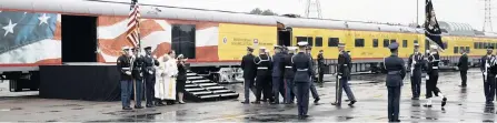  ??  ?? THE flag-draped casket of former president George H W Bush is carried by a joint services military guard of honour on Thursday, in Spring, Texas, to a special Union Pacific funeral train that carried Bush’s casket, family and close friends to College Station for a private burial service at his presidenti­al library. The journey took them through five Texas towns. | AP