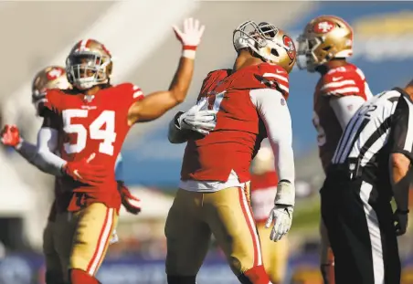  ?? Scott Strazzante / The Chronicle ?? Arik Armstead and Fred Warner celebrate a sack against the Rams. San Francisco has more sacks than all but five NFL teams.