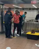  ?? ?? A screenshot of a video John Ajilo posted on his instagram showing him getting arrested by the NYPD for performing in the Herald Square subway station. Photograph: jazzajilo/Instagram