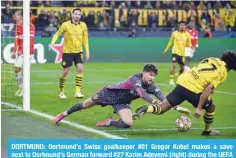  ?? ?? DORTMUND: Dortmund’s Swiss goalkeeper #01 Gregor Kobel makes a save next to Dortmund’s German forward #27 Karim Adeyemi (right) during the UEFA Champions League last 16, second-leg football match BVB Borussia Dortmund v PSV Eindhoven on March 13, 2024. — AFP