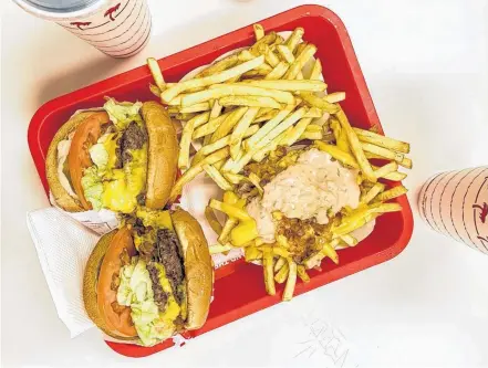  ?? GABBY PEYTON ?? At In-n-out, an American restaurant chain, its secret menu items are some of their most popular, like the Animal Style cheeseburg­er and Animal fries.