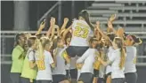  ?? ?? Villaverde gets a victory ride from her American Heritage teammates following the Region 4 Class 5A girls regional final on Tuesday night at Archbishop McCarthy High School in Southwest Ranches.