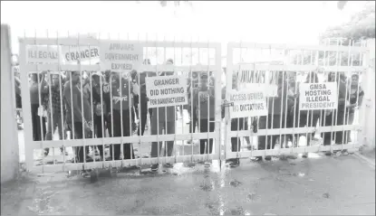  ??  ?? Protesters at the gates of the Pegasus Hotel