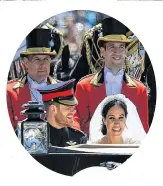  ?? JEFF J MITCHELL AP ?? Prince Harry and Meghan Markle ride along the Long Walk in an Ascot Landau carriage after their wedding ceremony at St. George’s Chapel in Windsor Castle on Saturday. •