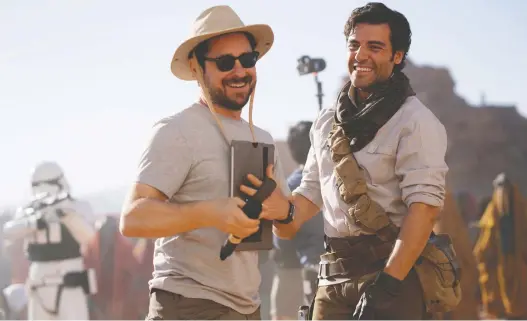  ?? JONATHAN OLLEY/LUCASFILM ?? Episode IX: The Rise of Skywalker, by director J.J. Abrams, left, and starring Oscar Isaac, is being released on DVD with a bonus behind-the-scenes documentar­y.