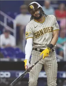  ?? WILFREDO LEE/AP ?? SAN DIEGO PADRES’ FERNANDO TATIS JR. reacts after striking out swinging to end the top of the ninth inning of a baseball game against the Miami Marlins, Wednesday in Miami.