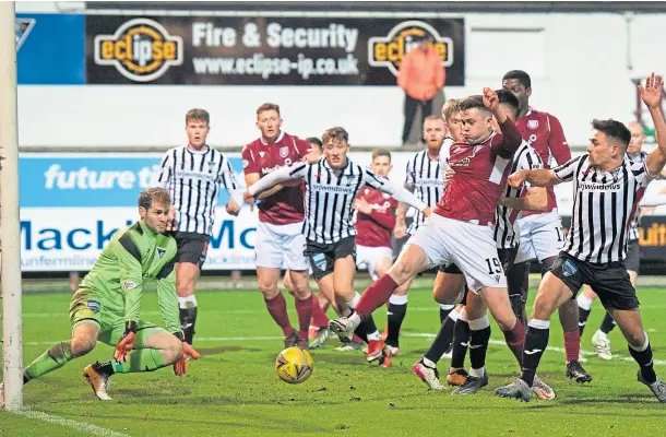  ?? ?? SCORING SENSATION: Arbroath hitman Anton Dowds (No 19) in the thick of the action against Dunfermlin­e on Boxing Day.
