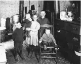 ??  ?? Right: Children in their Toronto home, circa early 1900s.