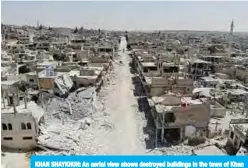  ??  ?? KHAN SHAYKHUN: An aerial view shows destroyed buildings in the town of Khan Sheikhun in the southern countrysid­e of Idlib. —AFP